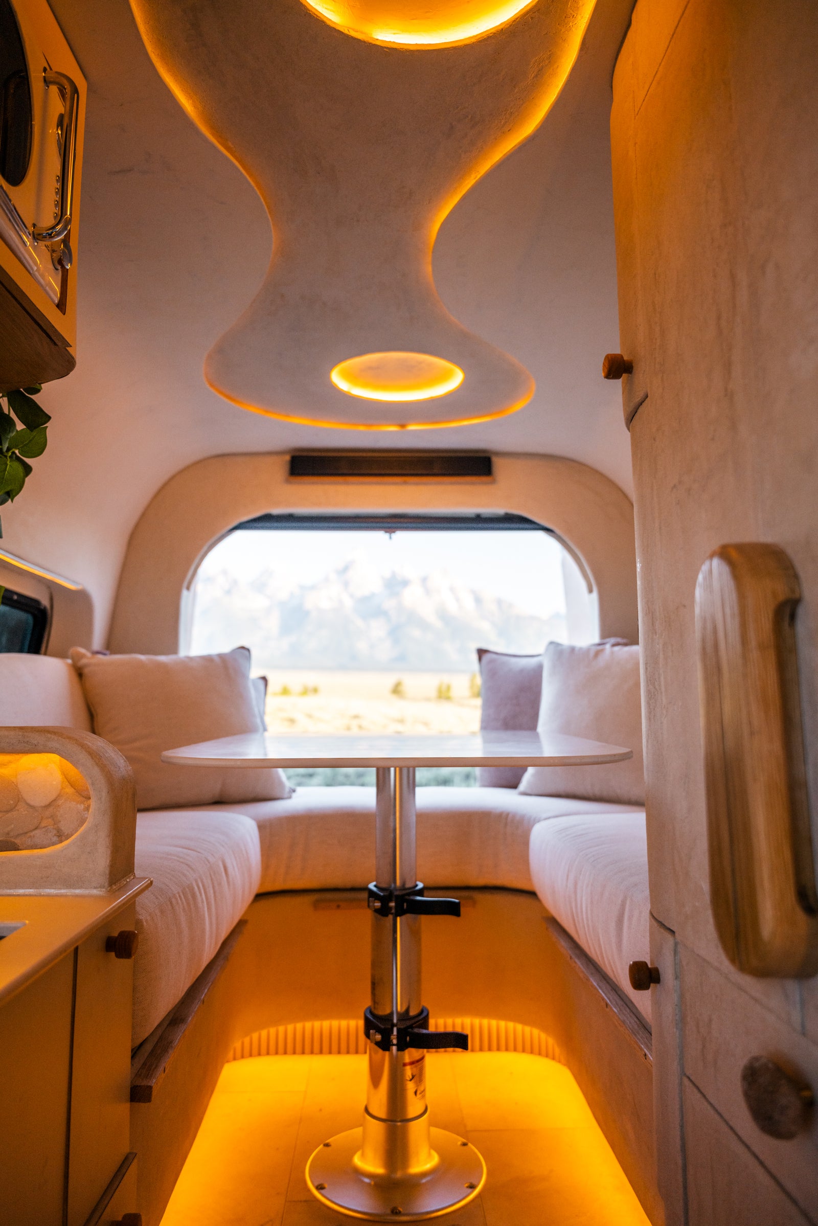 Flow's rear dinette and sculpted ceiling with the Tetons visible beyond the open doors