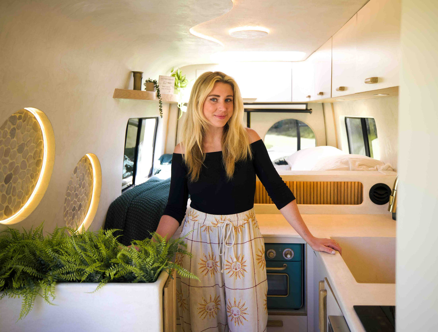 Abbe standing inside the Luna van kitchen